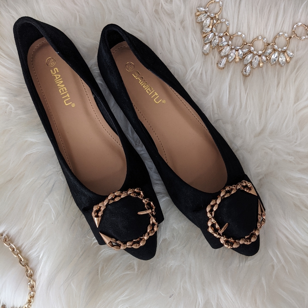Black pointed ballet flats with embellishm…